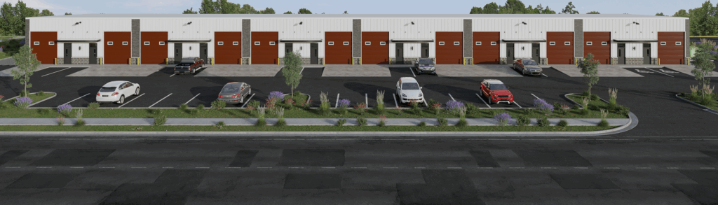 Industrial building with parking lot and cars.