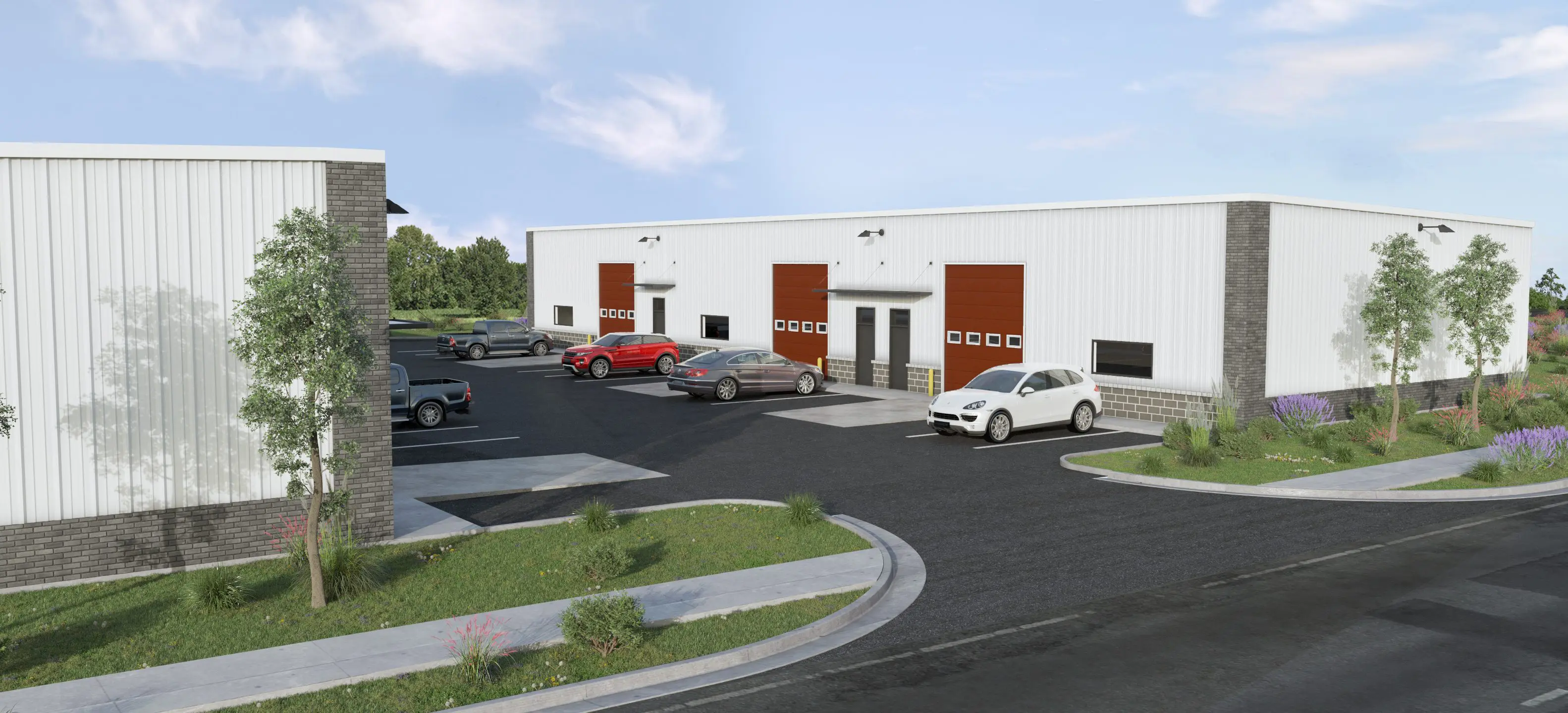Modern warehouse with loading docks and parked vehicles.