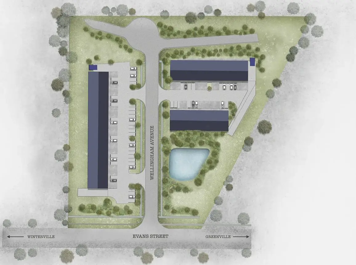 Aerial view of a modern campus with buildings, parking, and a pond.