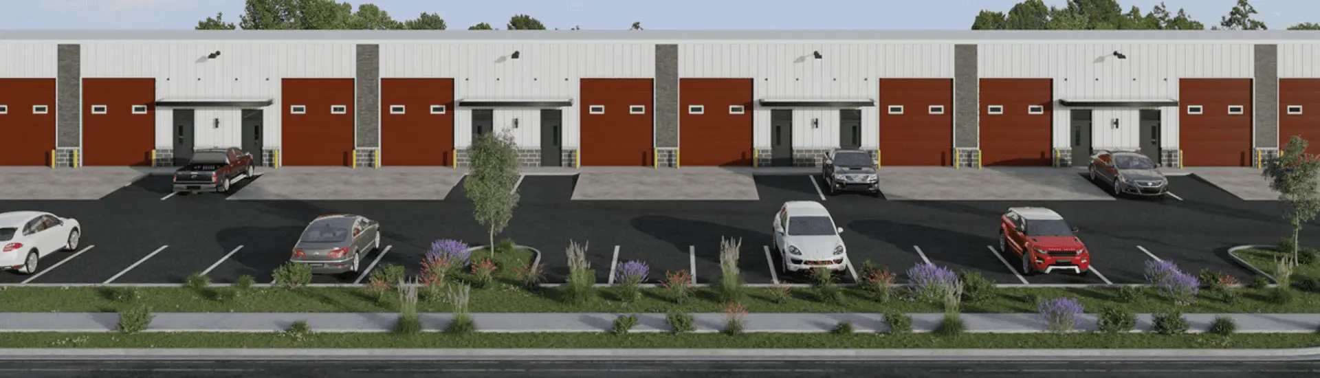 Warehouse building with parking lot and cars.